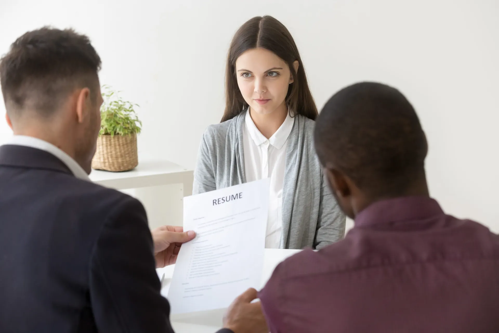 HR manager reading a CV during a job interview